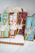 Load image into Gallery viewer, ONE HOME SWEET HOLIDAYS ALL-PURPOSE APRON & SPATULA SET - SHIPS ASSORTED