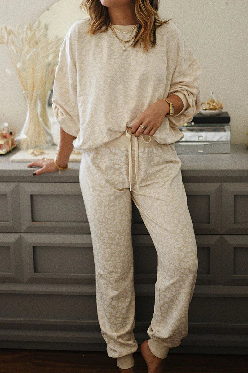 WHITE LEOPARD PRINT TOP AND PANTS LOUNGE SET **SHIPPING EXPECTED TO BEGIN ON DATE 8/30**